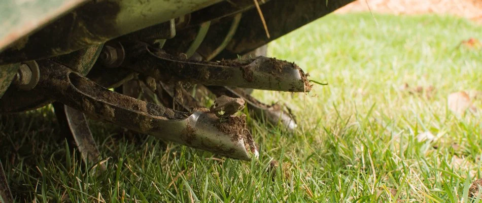 Lawn in Olathe, KS, with aerator machine.