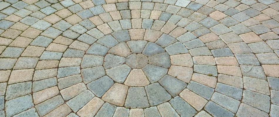 Round installation pattern for a paver patio in Olathe, KS.