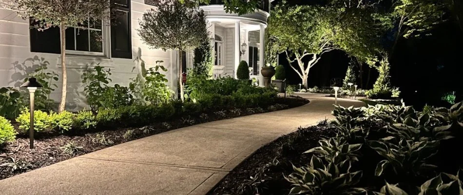 Landscaping with walkway and lighting on a property in Olathe, KS.