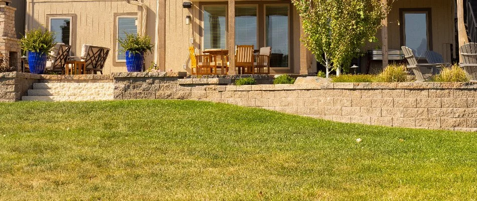 Lush lawn in Prairie Village, KS, next to a retaining wall.