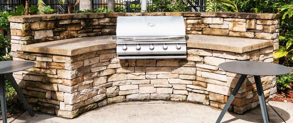 Outdoor kitchen in Olathe, KS, with grill and countertop.
