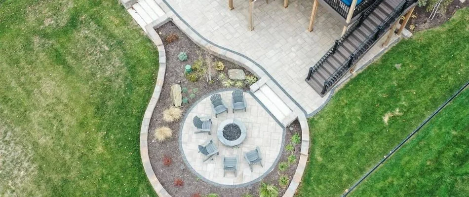 Patio, fire pit, and mulched landscape in Edgerton, KS.